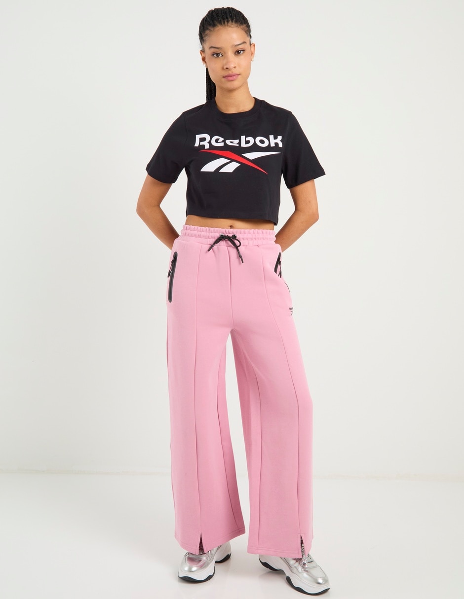 Pants acampanado Reebok con agujeta para mujer