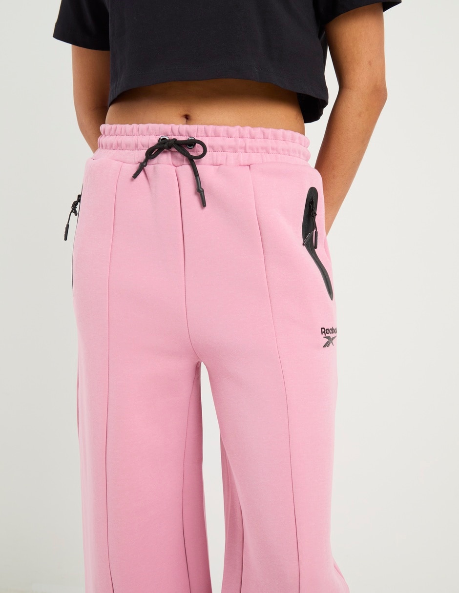 Pants acampanado Reebok con agujeta para mujer