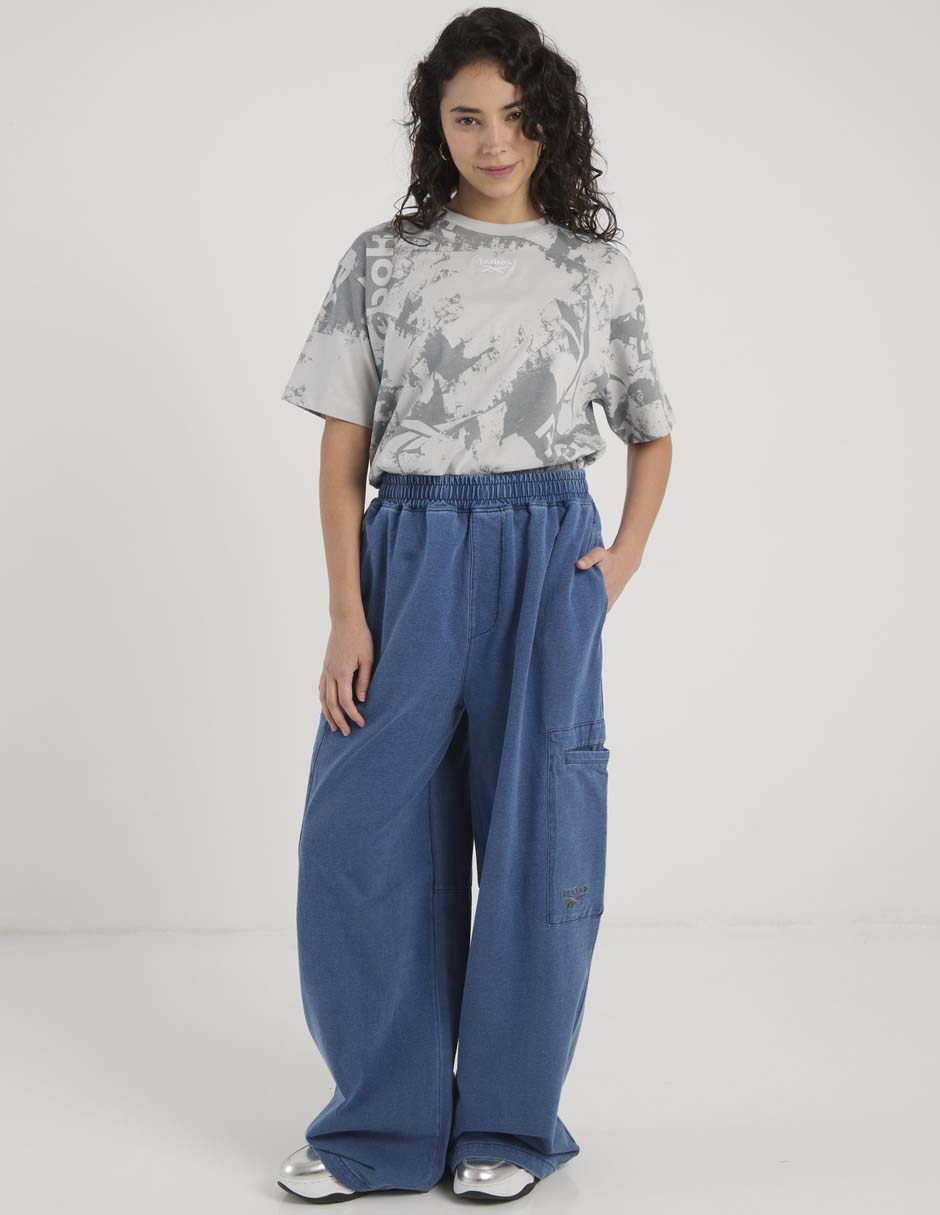 Pants acampanado Reebok con elástico para mujer