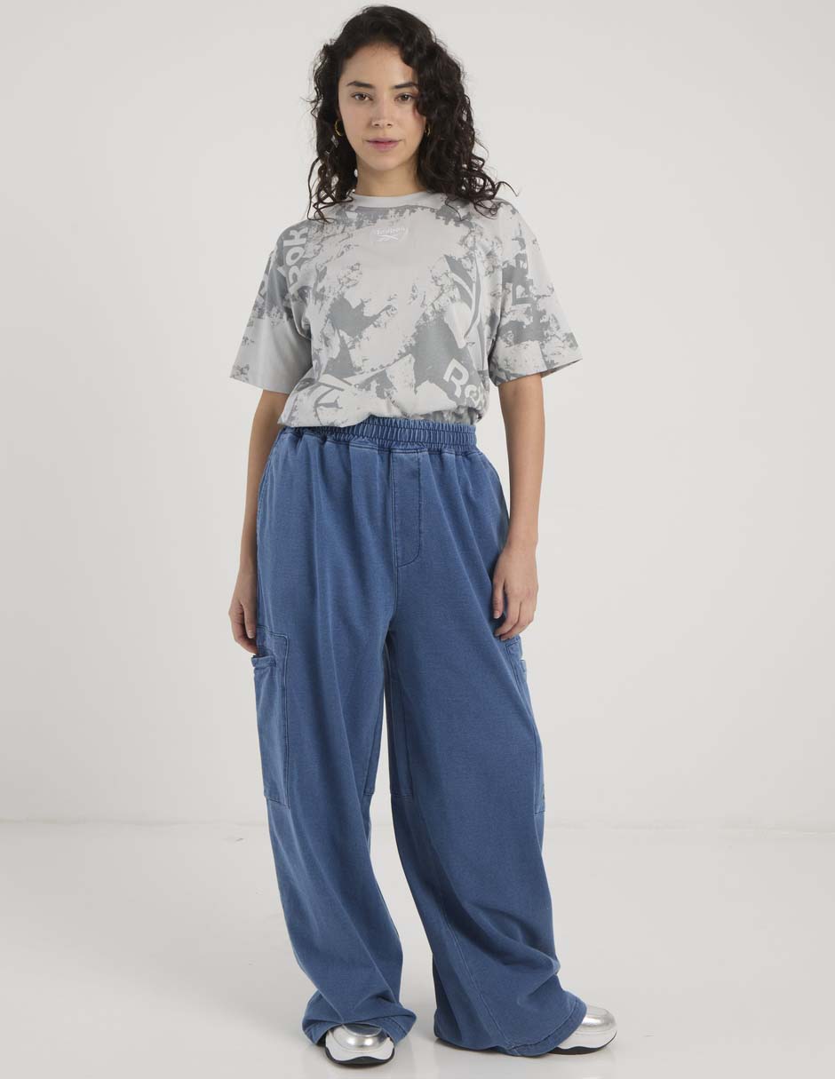 Pants acampanado Reebok con elástico para mujer