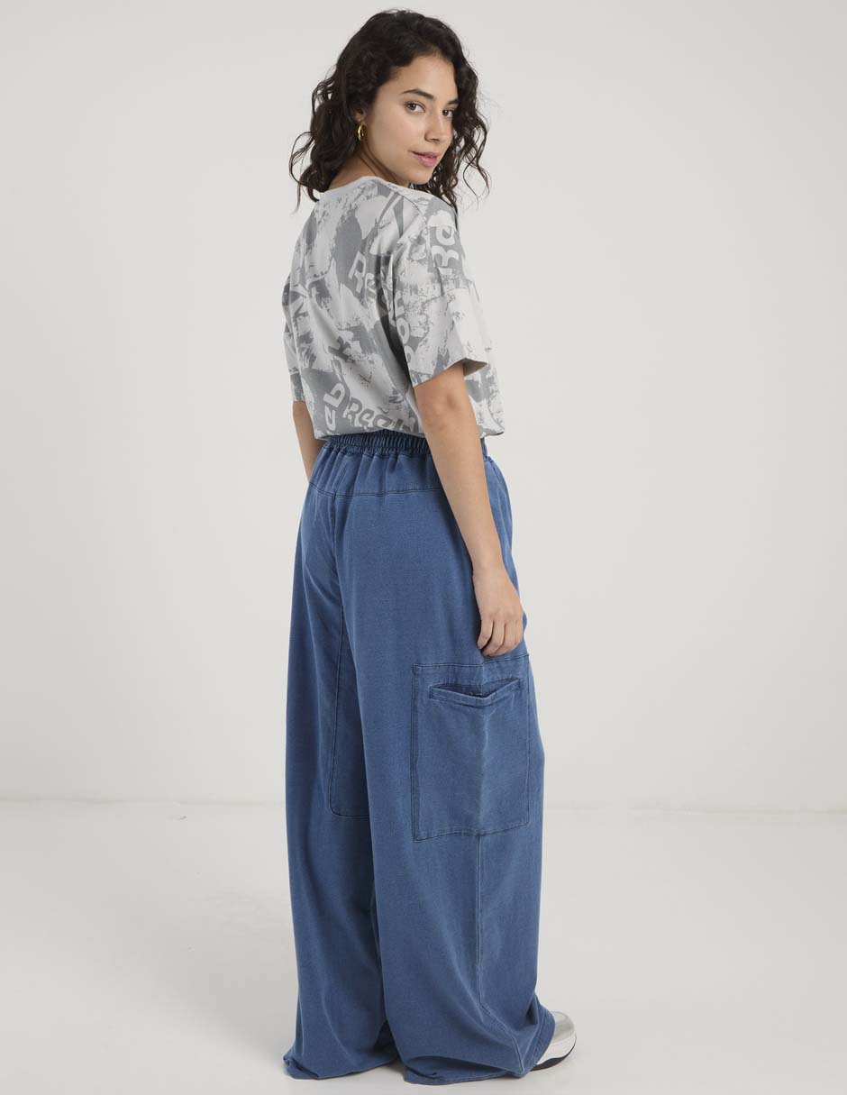 Pants acampanado Reebok con elástico para mujer